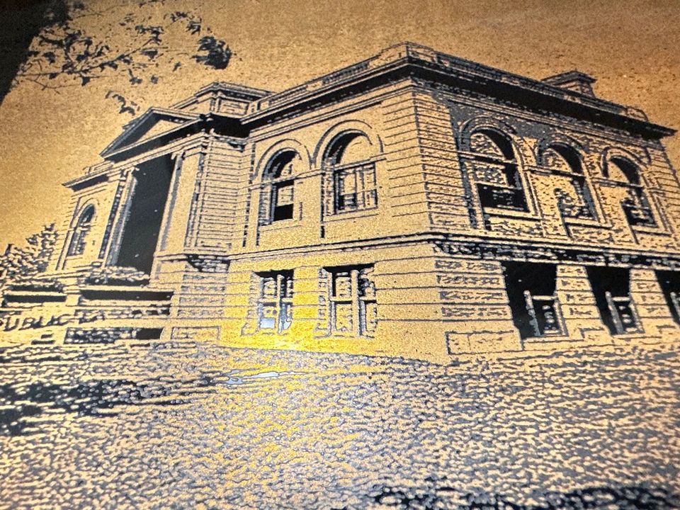 Laser cut and etched work by Proto.Hub