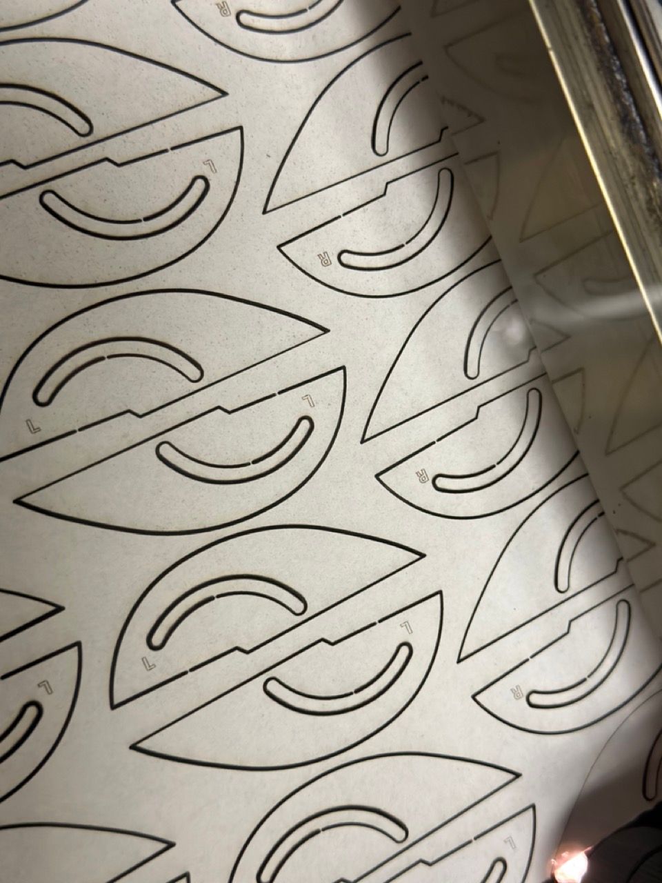 Laser cut and etched work by Proto.Hub