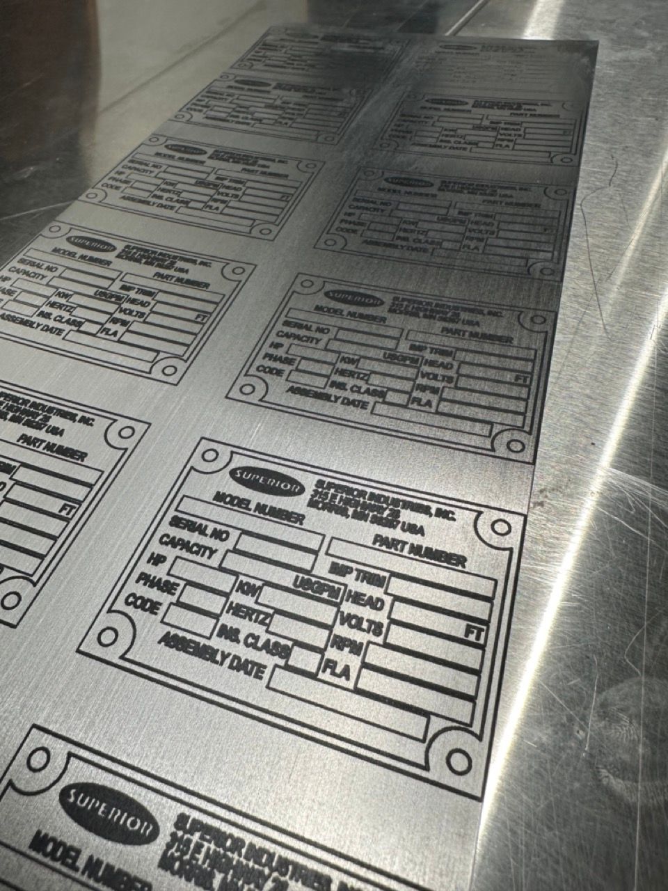 Laser cut and etched work by Proto.Hub